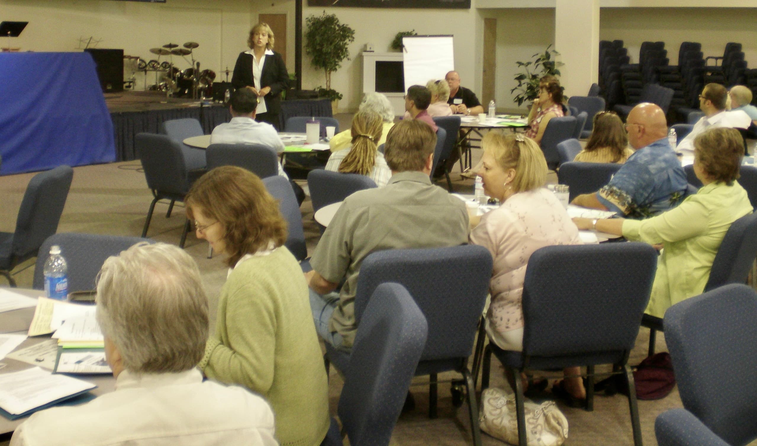Mary Cook facilitating a workshop with seated participants