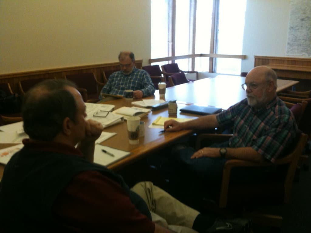 Working session with participants collaborating at a conference table